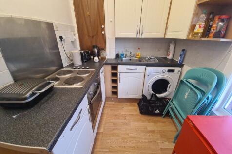 Compact and functional kitchen featuring essent...