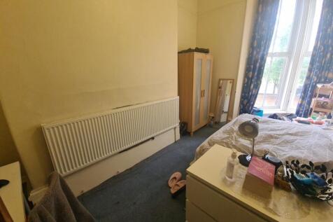 Bright and cozy double bedroom featuring a larg...