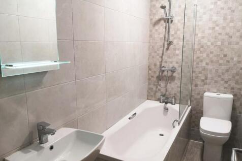 A modern and neatly maintained bathroom featuri...