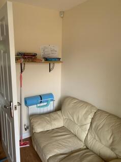 A cozy communal lounge area featuring a comfort...