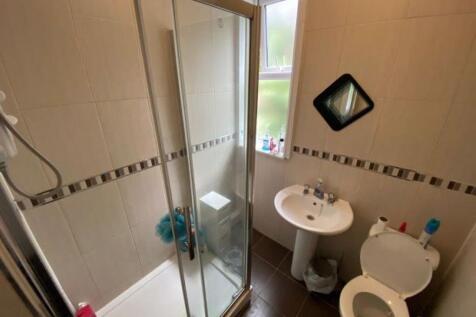 A clean and well-maintained bathroom featuring ...