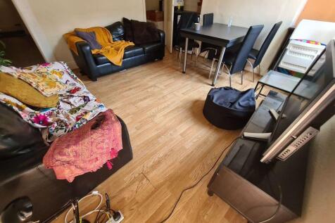 A cozy and functional living room featuring com...
