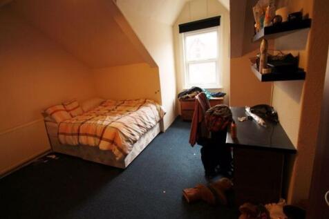 Cozy single bedroom with a comfortable bed, a d...