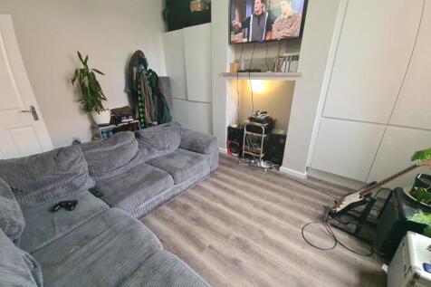 Cozy and modern living room featuring a comfort...