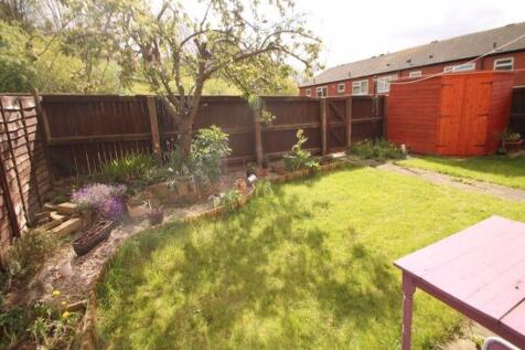 Bright and well-maintained garden with lush gre...