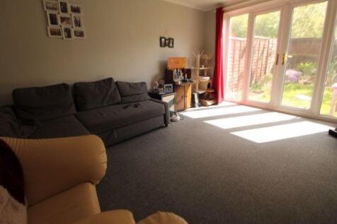 A bright and inviting living room with large gl...