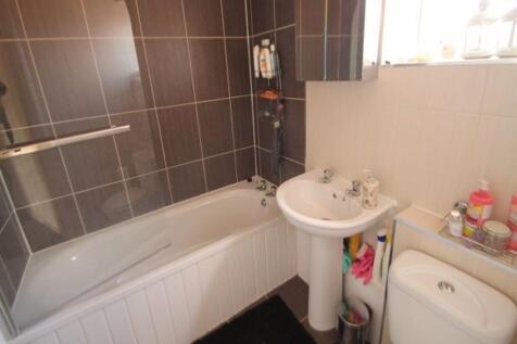 Bright and modern bathroom featuring a clean wh...