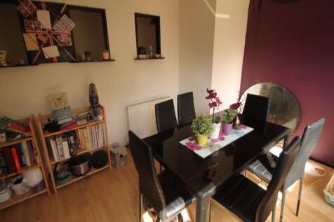 A bright and inviting living room featuring a m...