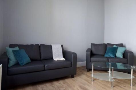 A modern living room featuring two comfortable ...