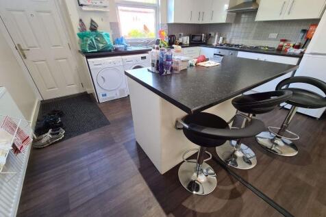 Bright and modern kitchen featuring a spacious ...