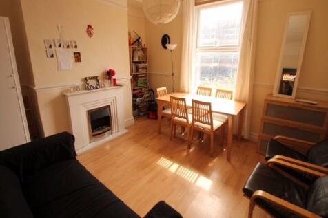 Bright and welcoming living room featuring natu...