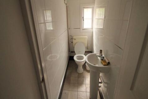 A neat and well-maintained small toilet room wi...