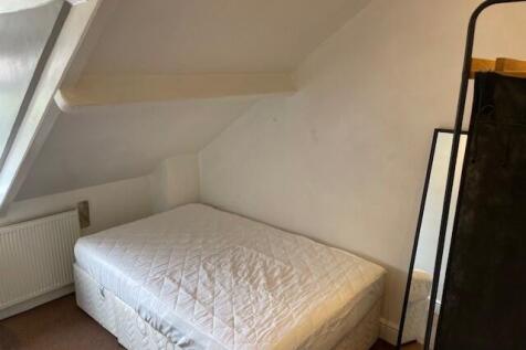 Cozy double bedroom featuring a comfortable dou...
