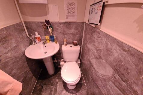 A modern bathroom featuring a clean pedestal si...