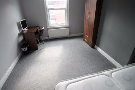 A neat and simple single bedroom featuring a cl...