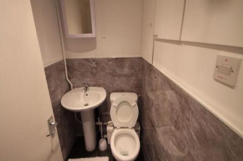 A clean and functional small bathroom featuring...