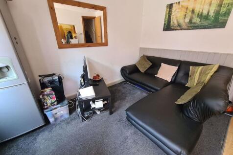 Cozy living room featuring a comfortable L-shap...