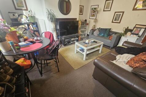 A cozy and inviting living room featuring comfo...