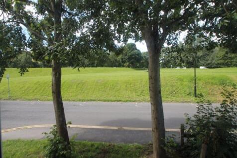 A peaceful garden area featuring a well-maintai...