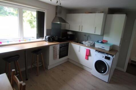 Bright and modern kitchen featuring ample natur...
