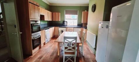 Bright and spacious kitchen featuring wooden ca...