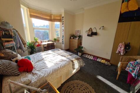 Bright and inviting master bedroom featuring a ...