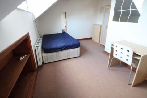 Bright and spacious bedroom featuring a comfort...