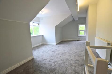 Bright and spacious master bedroom featuring fr...