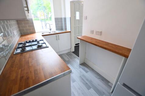 Bright and clean kitchen featuring wood-effect ...
