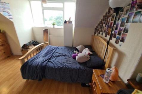 Cozy double bedroom featuring a comfortable woo...