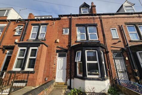 Traditional red-brick terraced house with class...