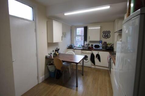 A bright and functional kitchen featuring woode...