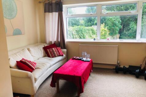 A cozy living room featuring a comfortable sofa...