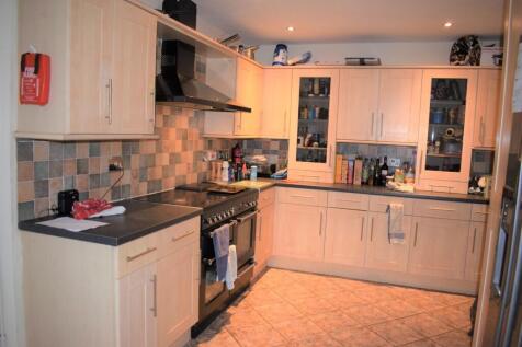 A well-equipped kitchen featuring modern applia...