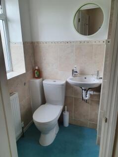 A modern bathroom featuring stylish tiles and a...