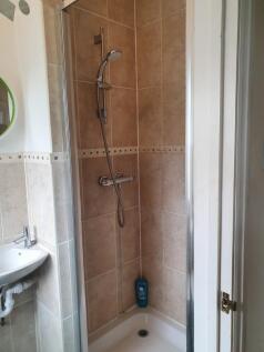 A well-maintained bathroom featuring a modern s...