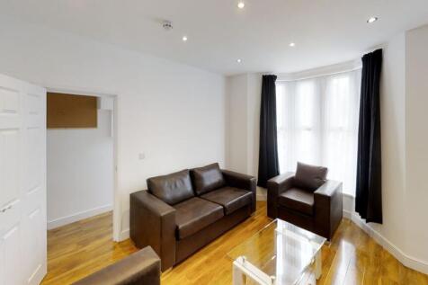 Bright and inviting living room featuring styli...