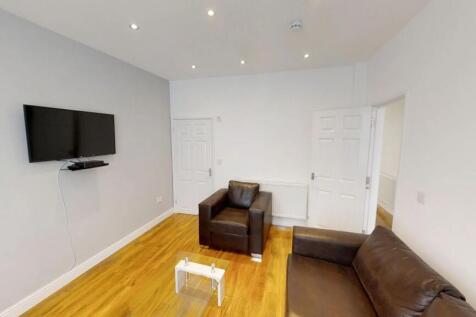 This inviting living room features stylish seat...