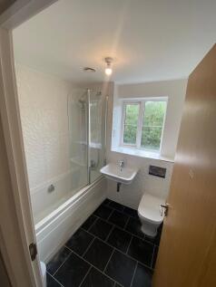 This modern bathroom features a stylish design ...