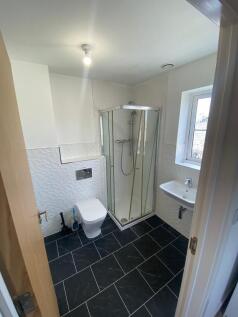 Modern bathroom featuring a sleek design with a...