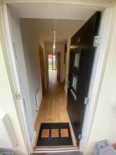 Welcoming entrance hallway with modern decor an...