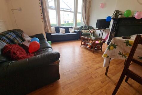 A warm and inviting living room featuring comfo...