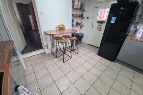 Bright and tidy kitchen space featuring ample f...