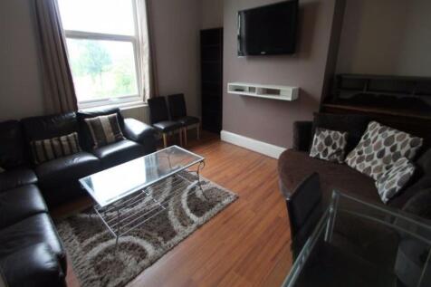 A comfortable living room featuring a large win...