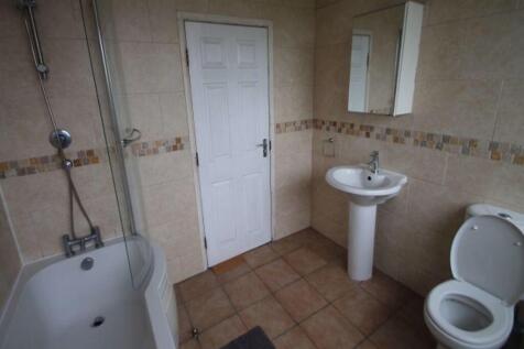 A clean and well-maintained bathroom featuring ...