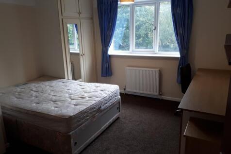 A bright and inviting double bedroom featuring ...
