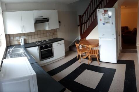 Spacious kitchen area featuring modern applianc...