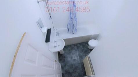 A compact and clean single toilet space with mo...