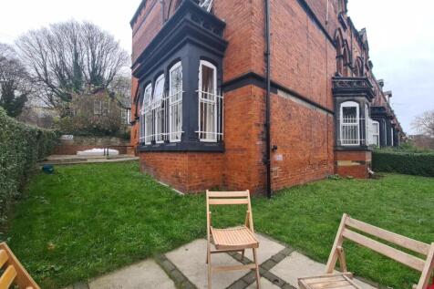 A charming and well-maintained garden area besi...