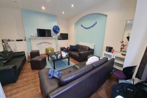 A comfortable living room featuring multiple le...
